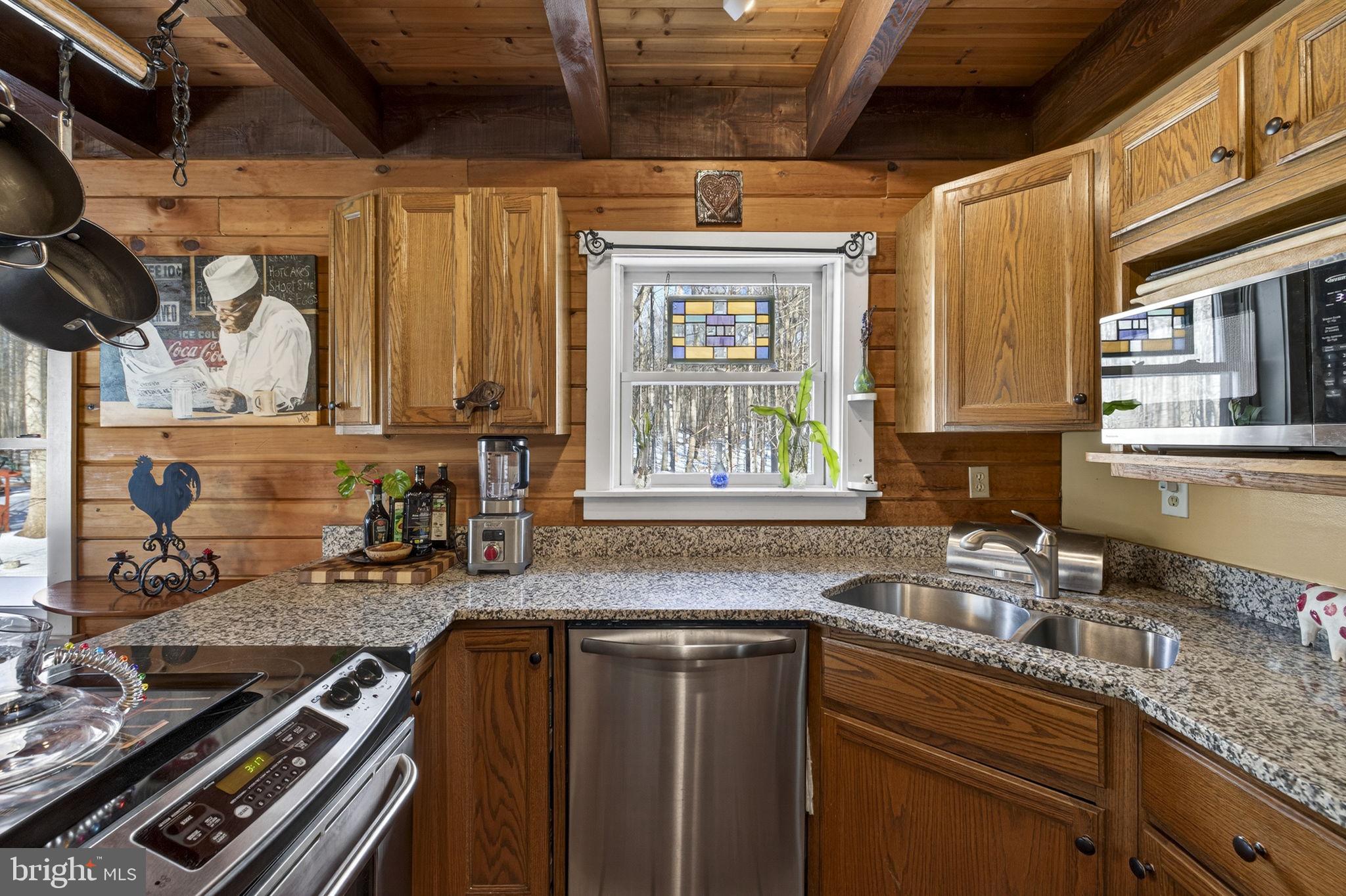 10418 Cliff Mills Road Marshall, VA 20115 - Photo 29 of 93 a kitchen with stainless steel appliances granite countertop a sink stove and cabinets