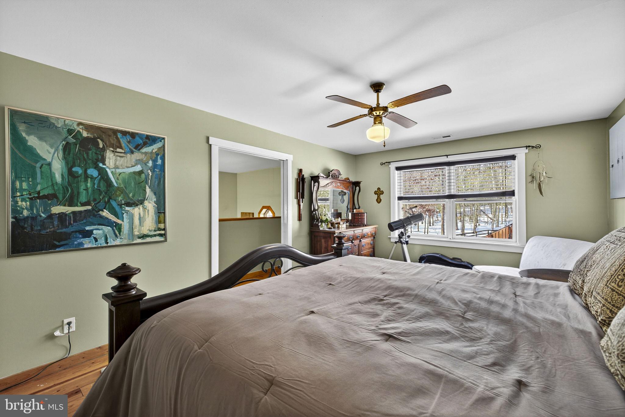 10418 Cliff Mills Road Marshall, VA 20115 - Photo 46 of 93 a bedroom with a large bed and a large window