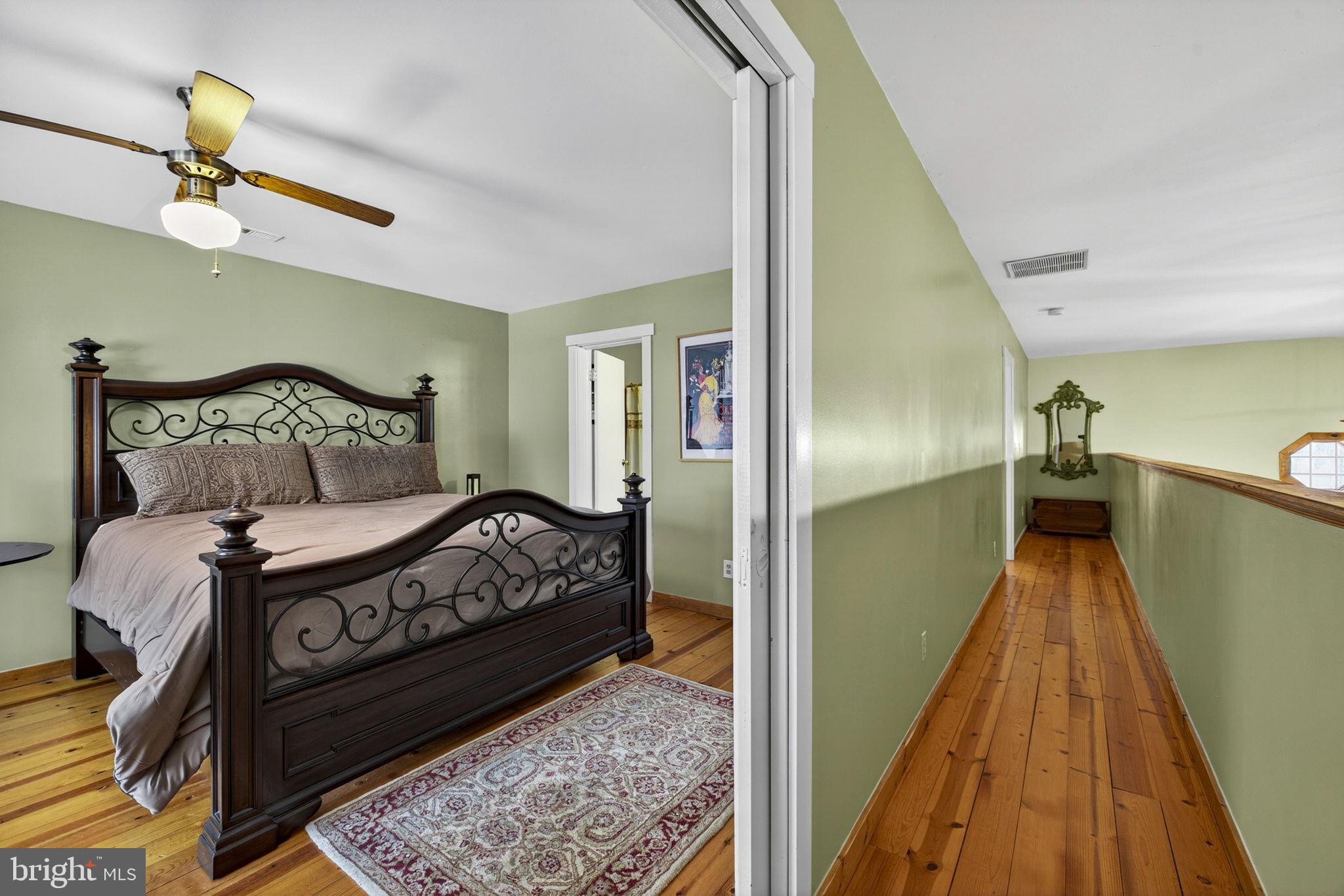 10418 Cliff Mills Road Marshall, VA 20115 - Photo 47 of 93 a bed sitting in a bedroom next to a window