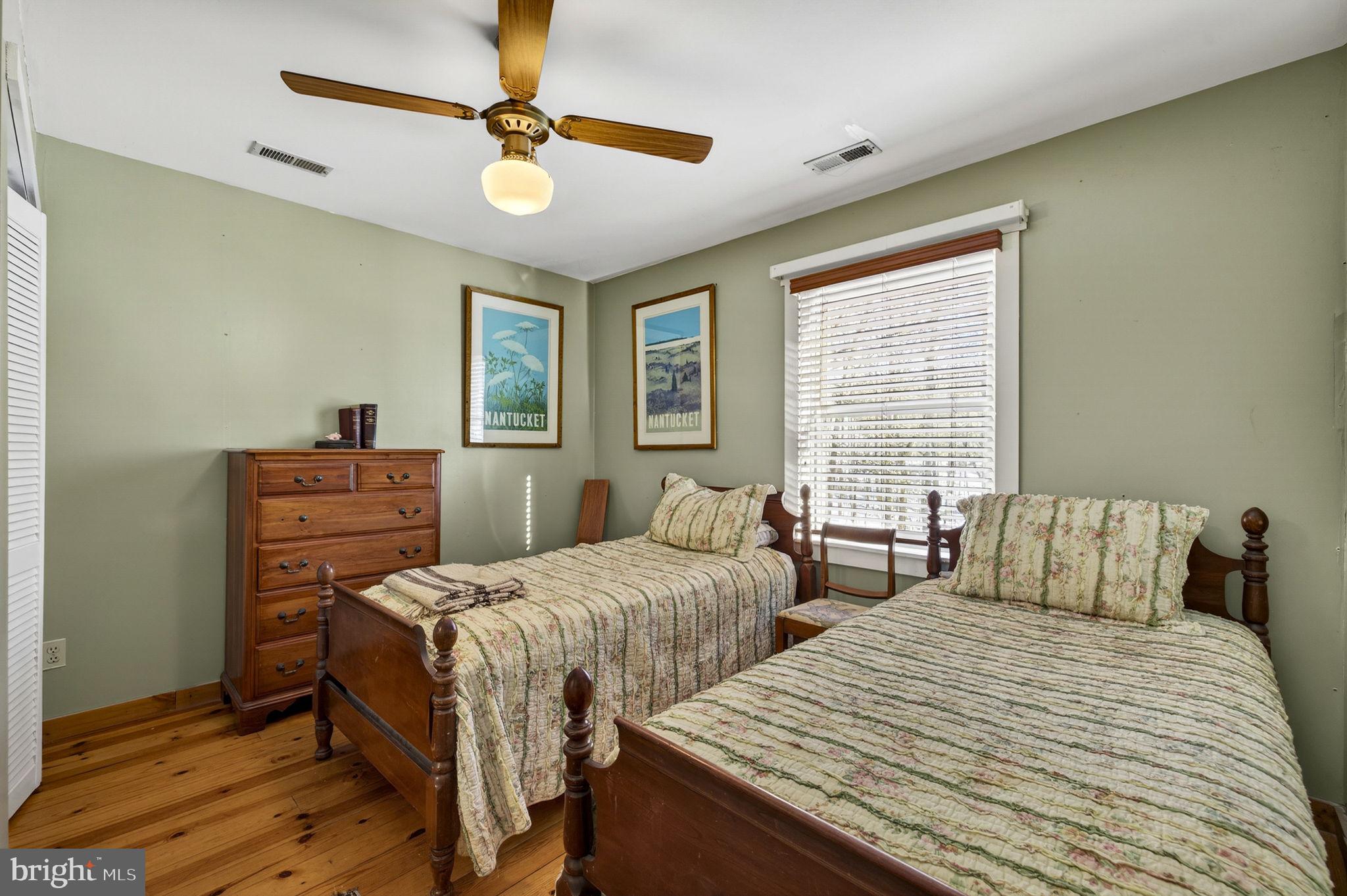 10418 Cliff Mills Road Marshall, VA 20115 - Photo 49 of 93 a bedroom with two beds and a dresser