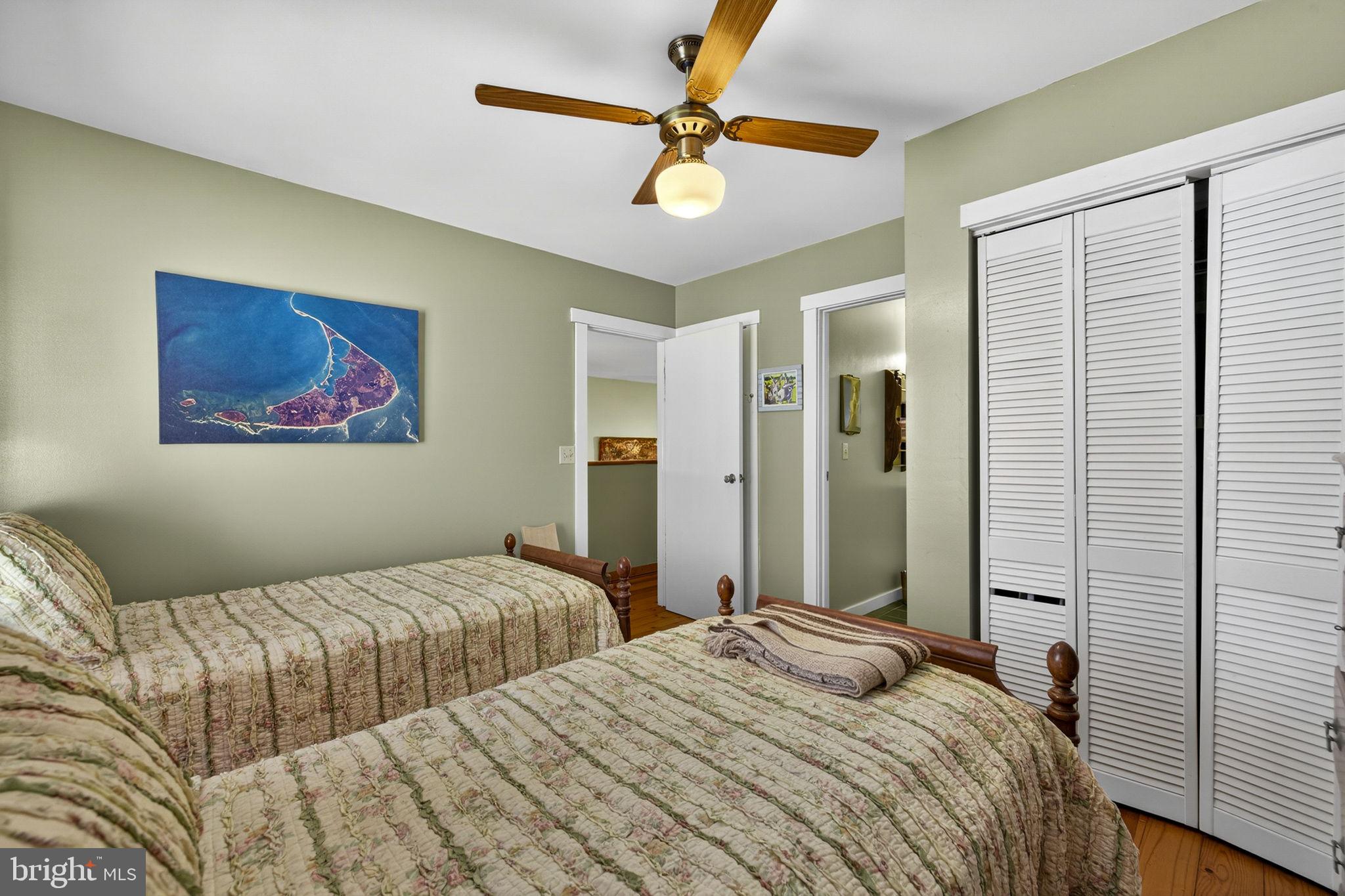 10418 Cliff Mills Road Marshall, VA 20115 - Photo 50 of 93 a bedroom with a large bed and a chandelier