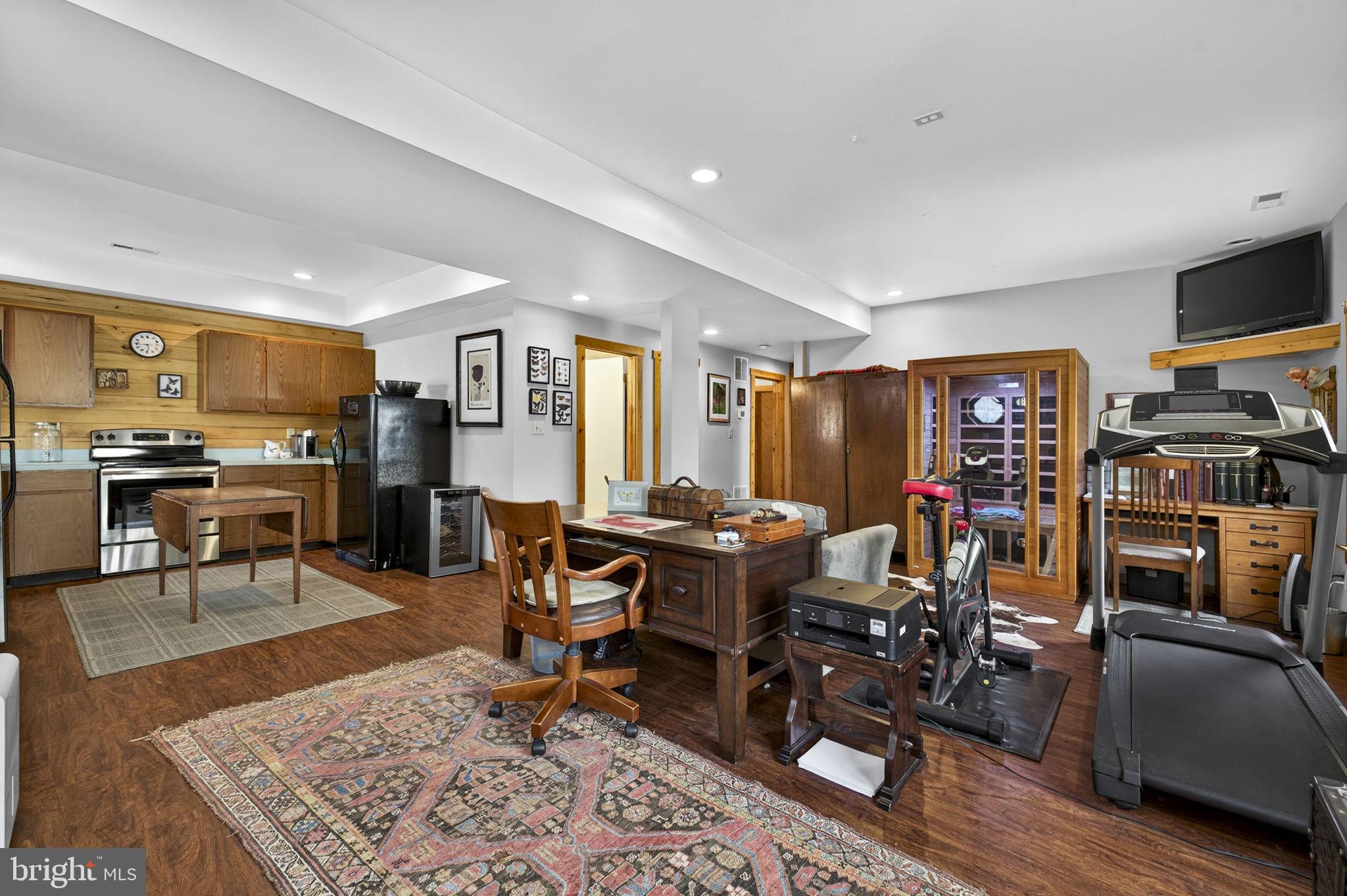 10418 Cliff Mills Road Marshall, VA 20115 - Photo 61 of 93 a living room with lots of furniture and a flat screen tv