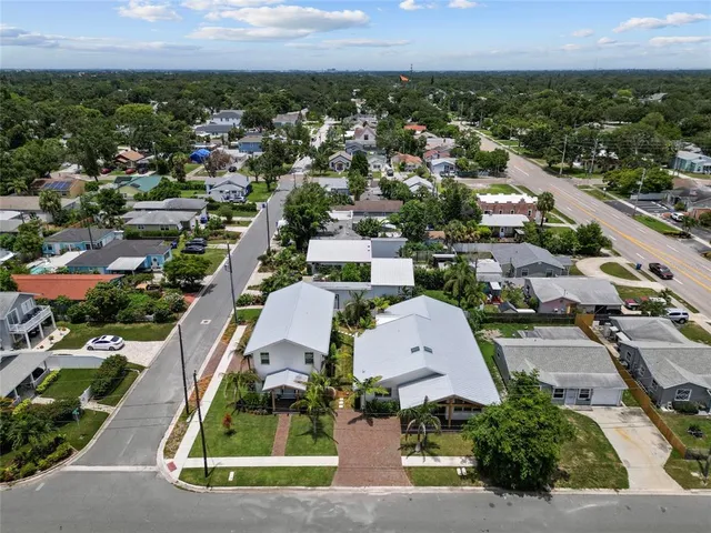 an aerial view of residential houses with outdoor space