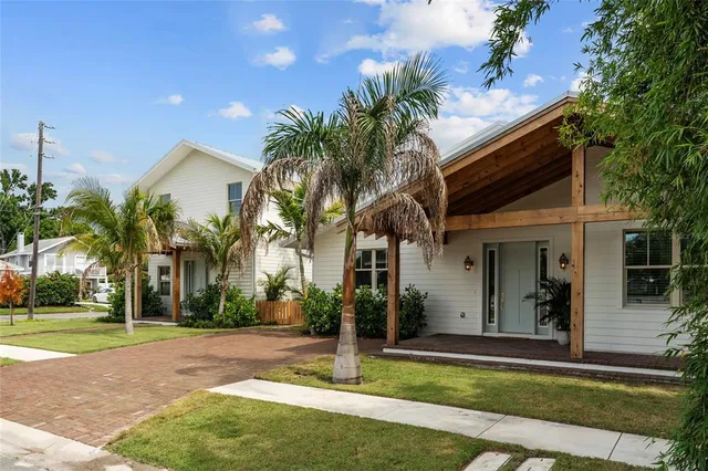 a front view of house with yard and green space