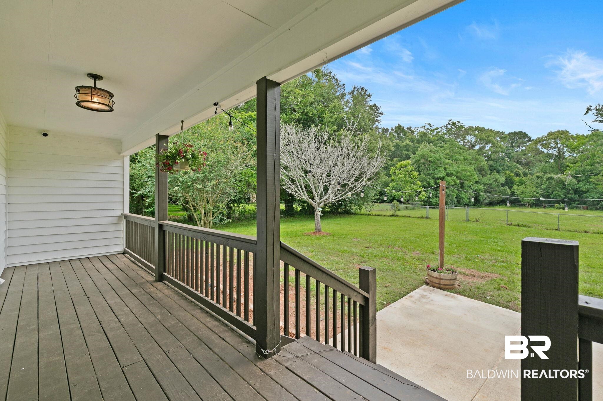 22810 High Ridge Road Fairhope, AL 36532 - Photo 61 of 78 Covered porch with wood-finish flooring and white siding