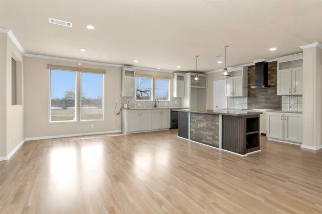 a view of kitchen with wooden floor and window