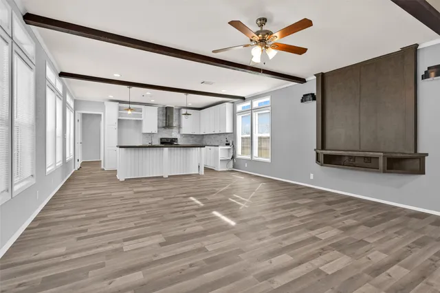 a view of kitchen with furniture and wooden floor