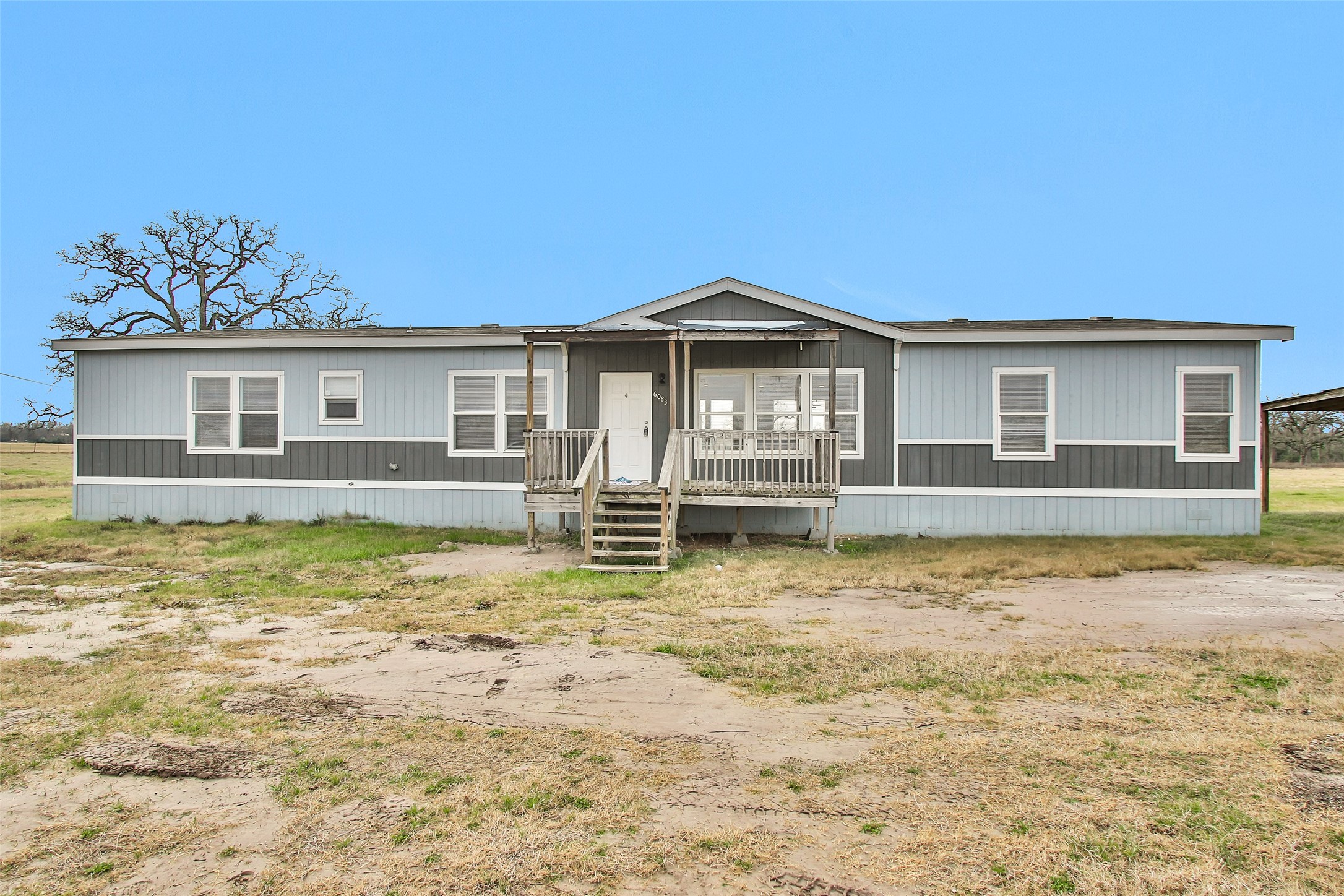6083 Fm 3060 Midway, TX 75852 - Photo 8 of 49 a front view of a house with a yard