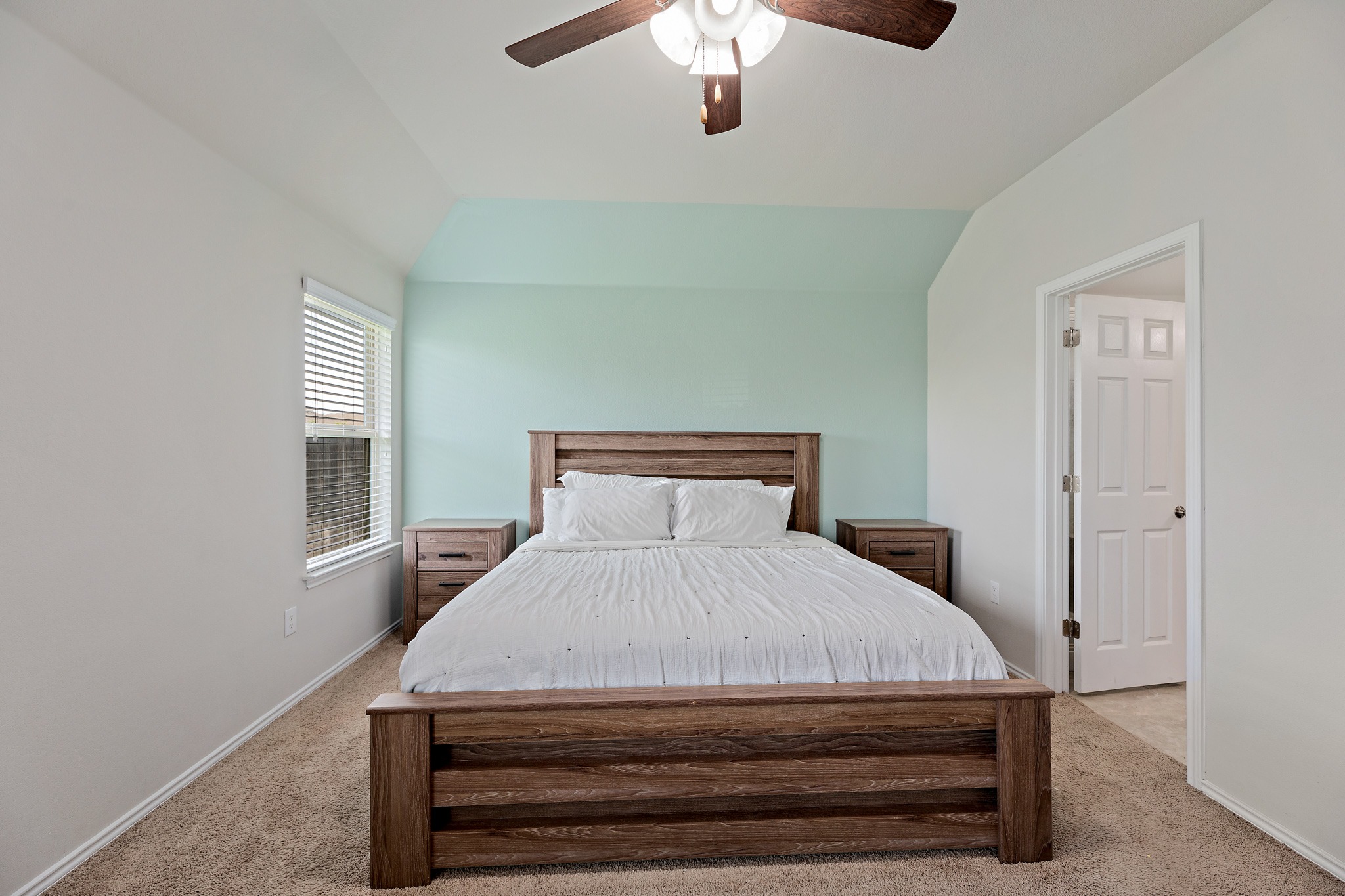 382 Limerick Road Buda, TX 78610 - Photo 10 of 20 A tranquil bedroom retreat features a neutral color palette, plush carpeting, and a light-filled window.