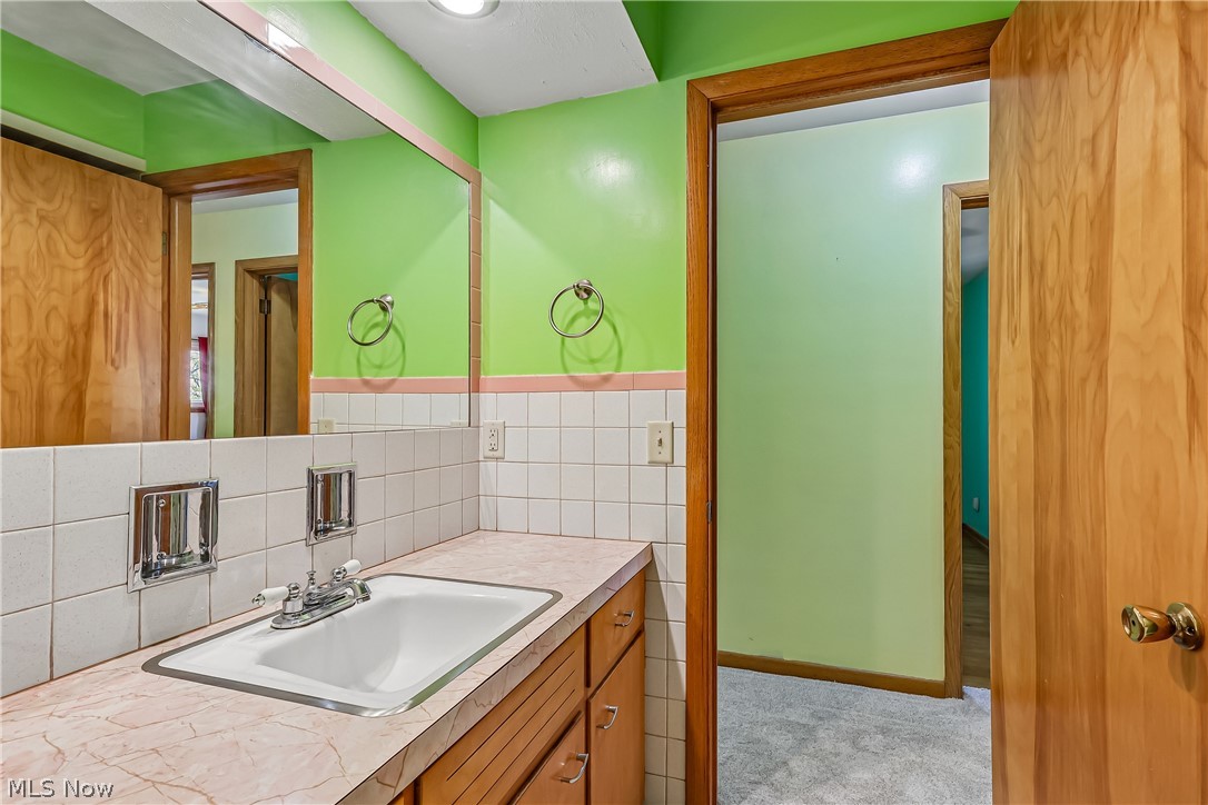 2060 6th Street Southwest Akron, OH 44314 - Photo 20 of 46 Half bath with sink, vanity and commode