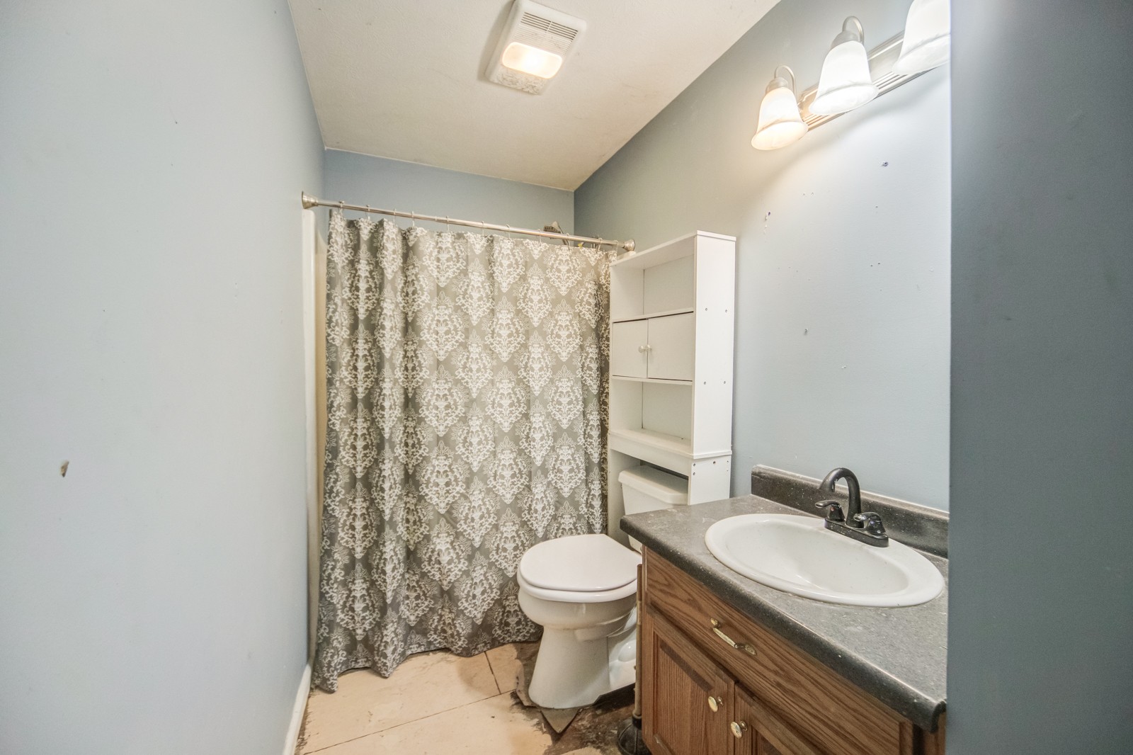 175 Crawford Hill Road Goodlettsville, TN 37072 - Photo 11 of 21 a bathroom with a granite countertop sink toilet a mirror and a shower