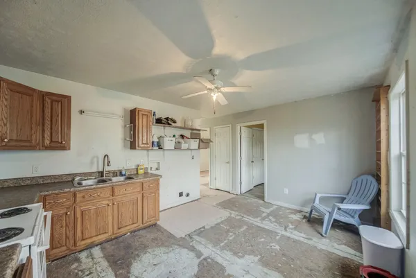 a kitchen with stainless steel appliances granite countertop a stove and cabinets