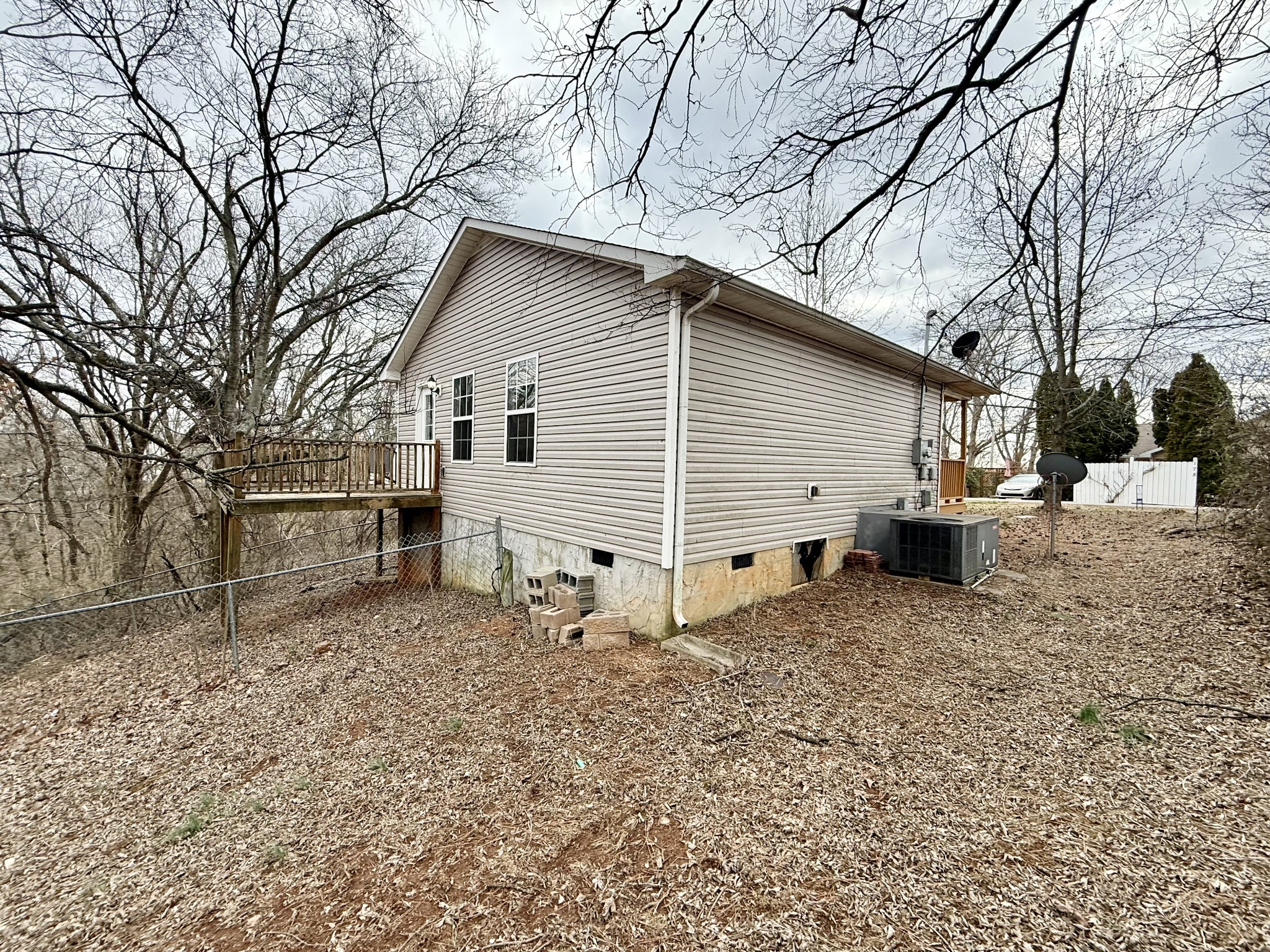 175 Crawford Hill Road Goodlettsville, TN 37072 - Photo 19 of 21 a white house that has a tree in front of it