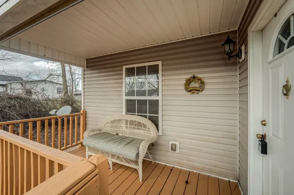 a view of balcony with wooden floor