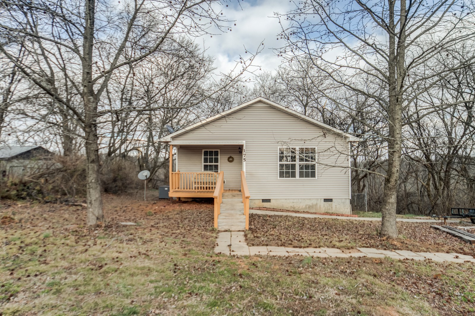 175 Crawford Hill Road Goodlettsville, TN 37072 - Photo 4 of 21 a view of a house with a yard covered in snow