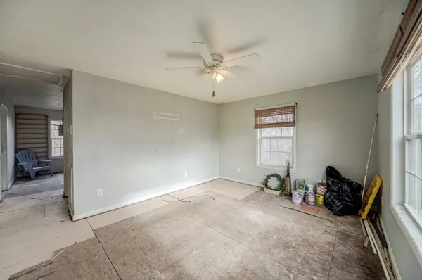 a view of an empty room with a window