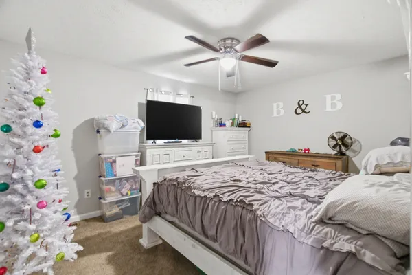 a room that has a bed and a table in it