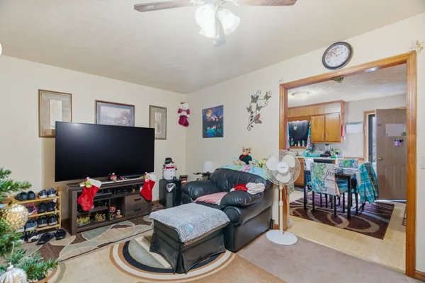 a kitchen with a refrigerator and a stove top oven