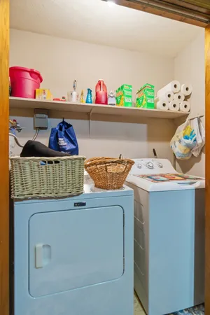 a view of hallway with stairs and wooden floor