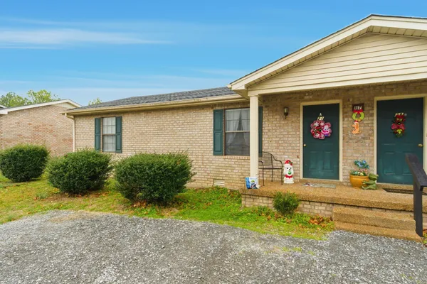 a front view of a house with garden