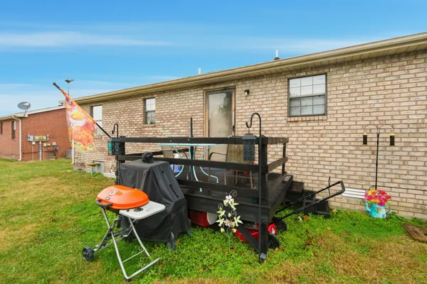 a view of yard with swimming pool and seating