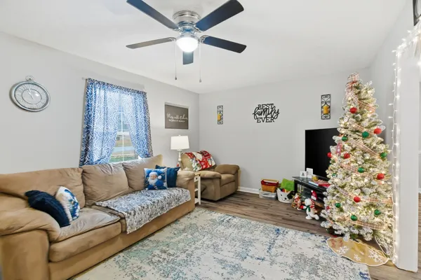 a living room with furniture and a flat screen tv