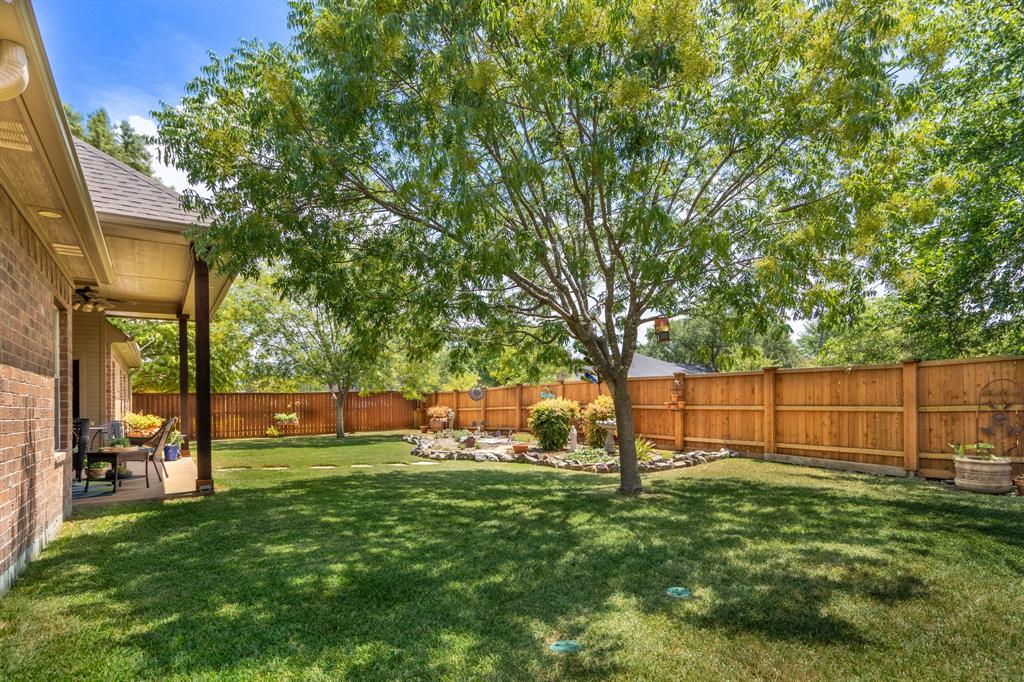 111 Reba Road Heath, TX 75126 - Photo 1 of 1 a view of a park with large trees
