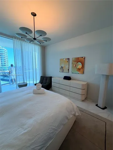 a spacious bathroom with a double vanity sink mirror and bathtub