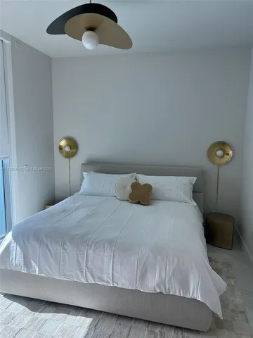 a bathroom with a sink toilet and a mirror