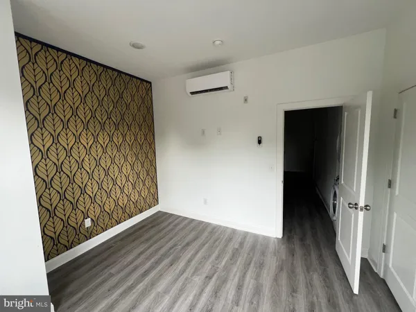 wooden floor in a hall with an entryway