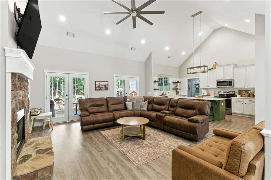 62 Joe Rowell Road Buchanan, GA 30113 - Photo 14 of 63 a living room with furniture fireplace and a flat screen tv