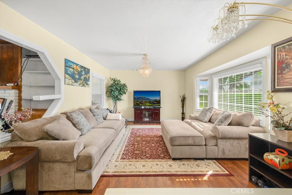 2183 Sinclair Street Pomona, CA 91767 - Photo 17 of 38 a living room with furniture fireplace and a flat screen tv