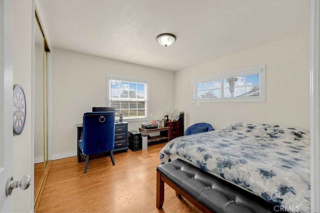 2183 Sinclair Street Pomona, CA 91767 - Photo 31 of 38 a bedroom with a bed and dresser