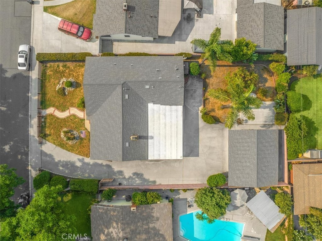 2183 Sinclair Street Pomona, CA 91767 - Photo 36 of 38 a front view of a house with a yard and garden