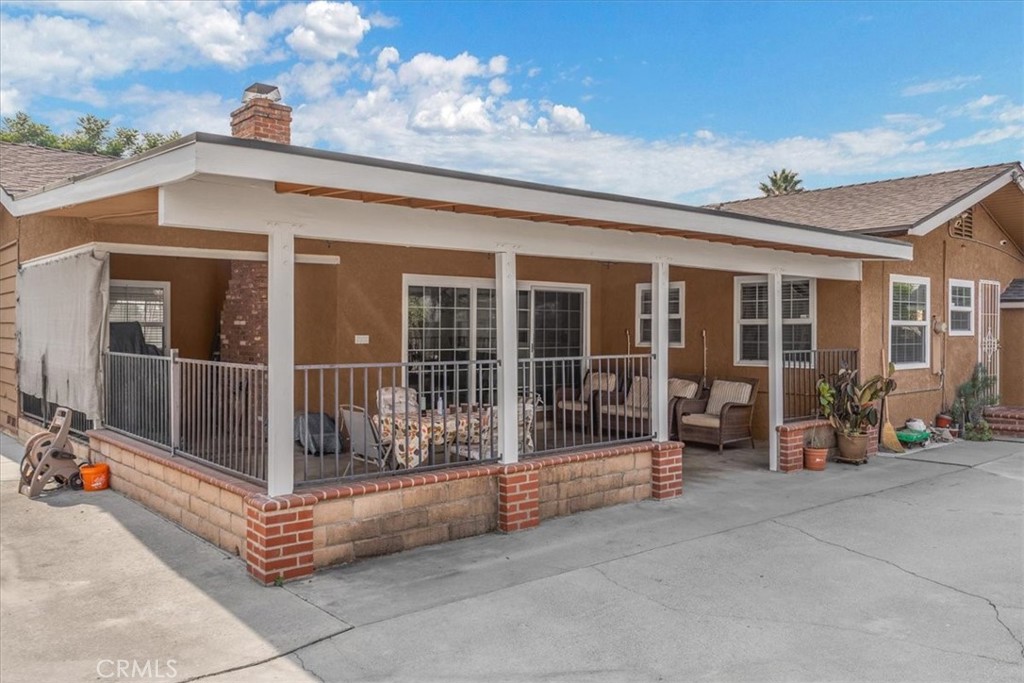 2183 Sinclair Street Pomona, CA 91767 - Photo 7 of 38 a view of a building with glass door and porch