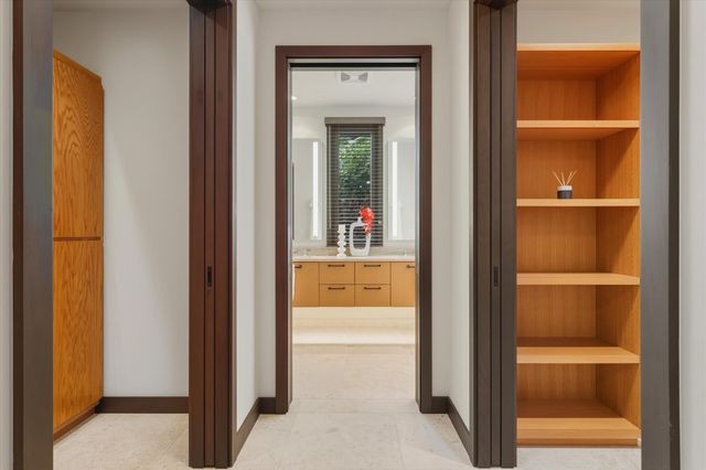 a view of a bathroom from a hallway