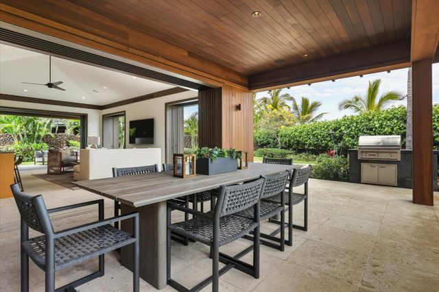 a outdoor dining space with furniture and outdoor view