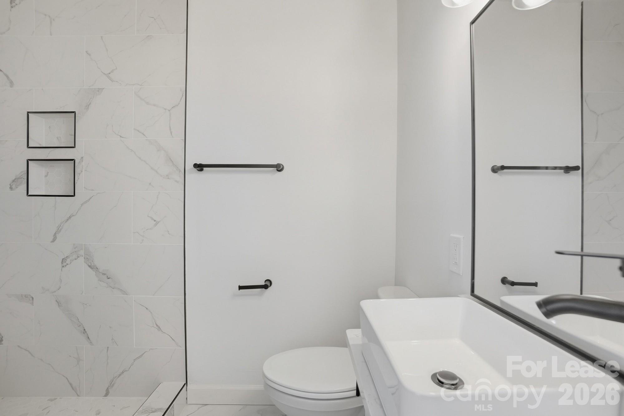 318 Hollis Road Charlotte, NC 28209 - Photo 14 of 30 a bathroom with a granite countertop sink toilet and shower