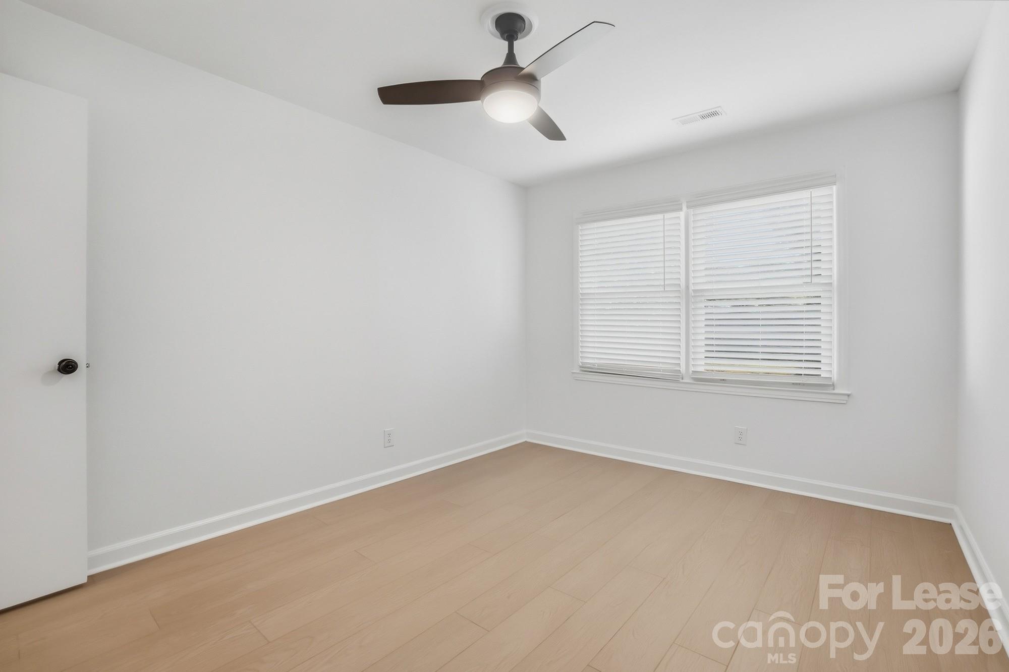 318 Hollis Road Charlotte, NC 28209 - Photo 18 of 30 a view of an empty room with a window