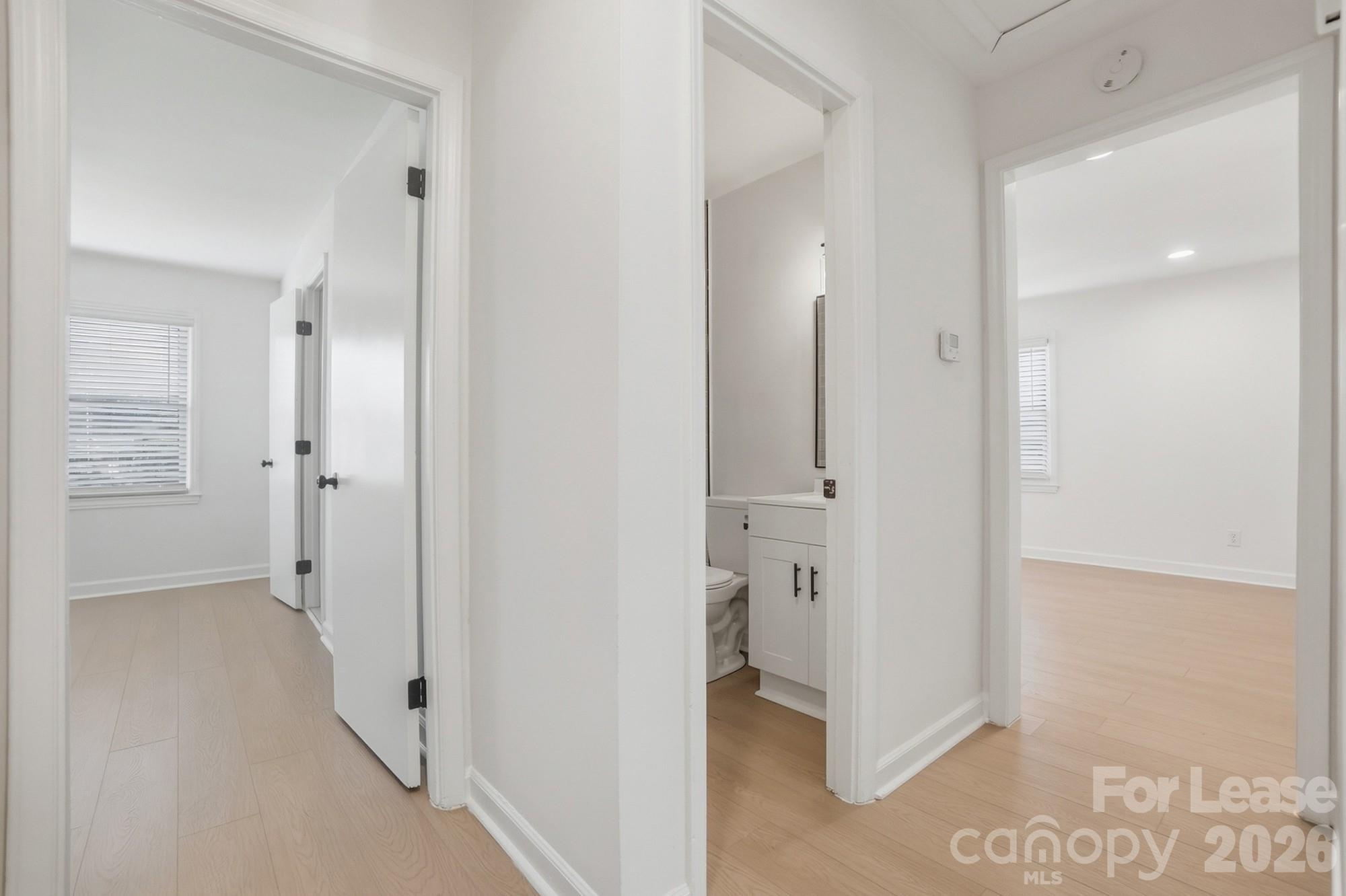 318 Hollis Road Charlotte, NC 28209 - Photo 20 of 30 a view of a bathroom with a sink and mirror