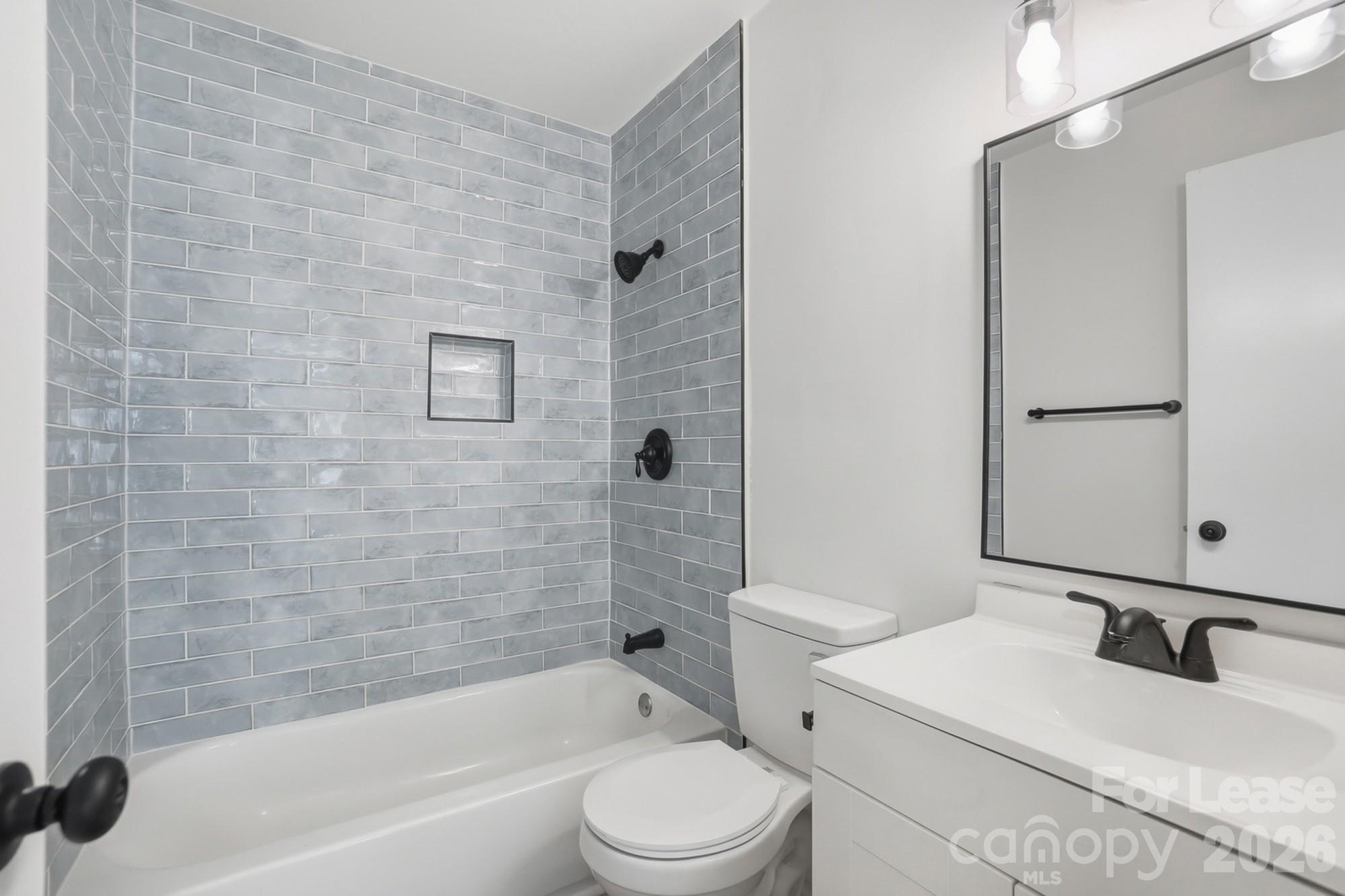 318 Hollis Road Charlotte, NC 28209 - Photo 21 of 30 a bathroom with a sink toilet and shower