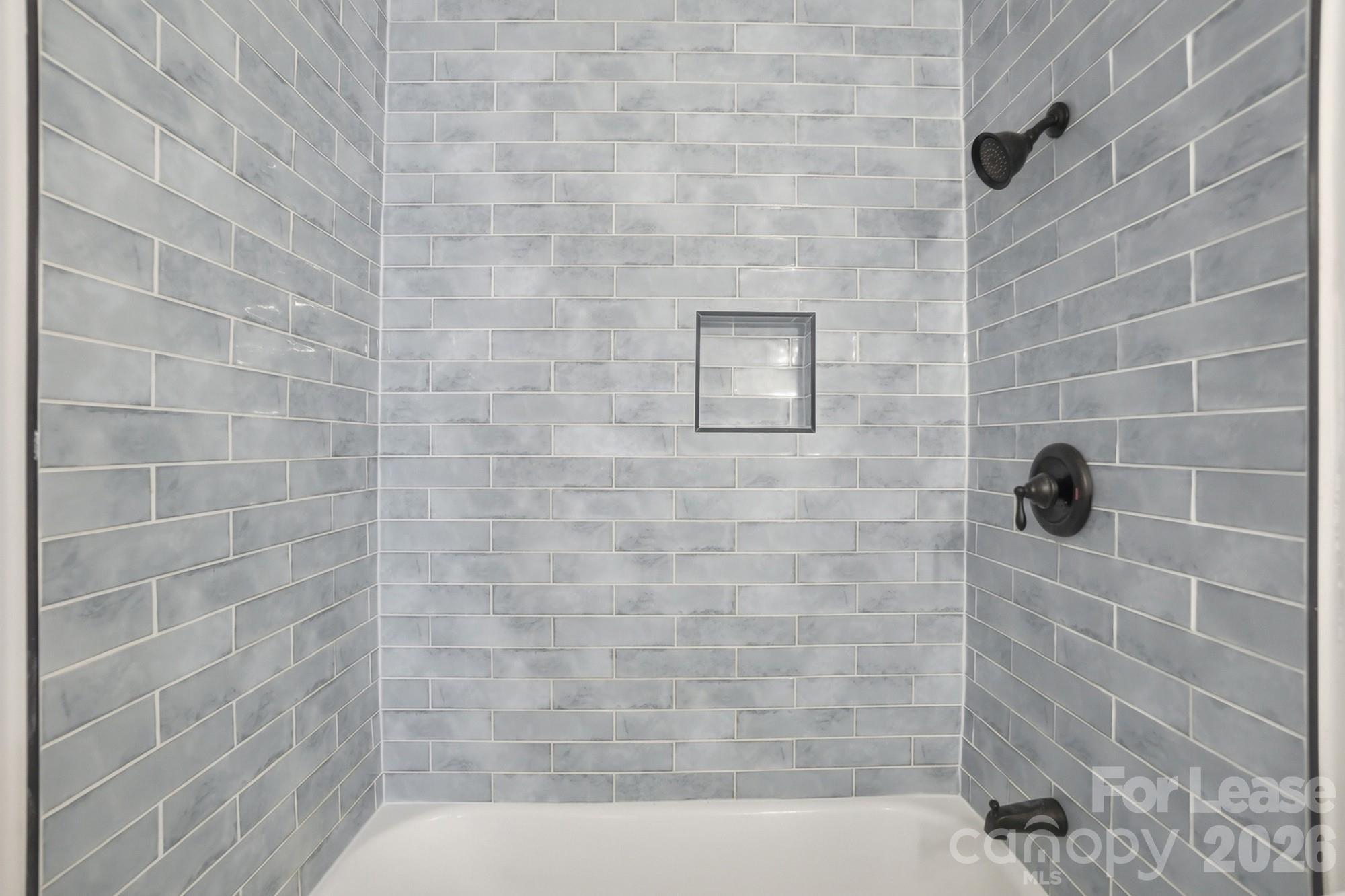 318 Hollis Road Charlotte, NC 28209 - Photo 22 of 30 a bathroom with a shower