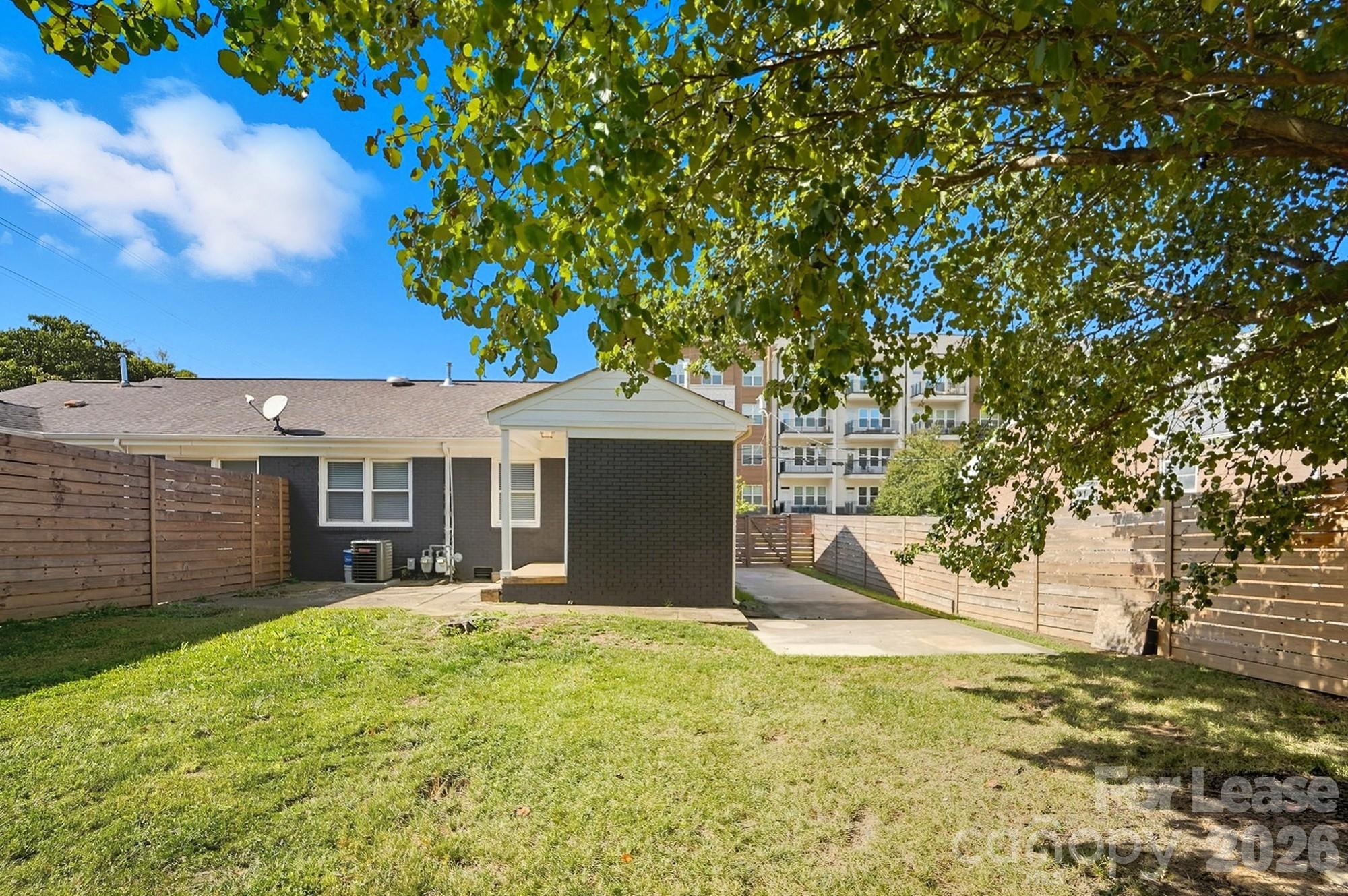 318 Hollis Road Charlotte, NC 28209 - Photo 26 of 30 a front view of a house with a yard