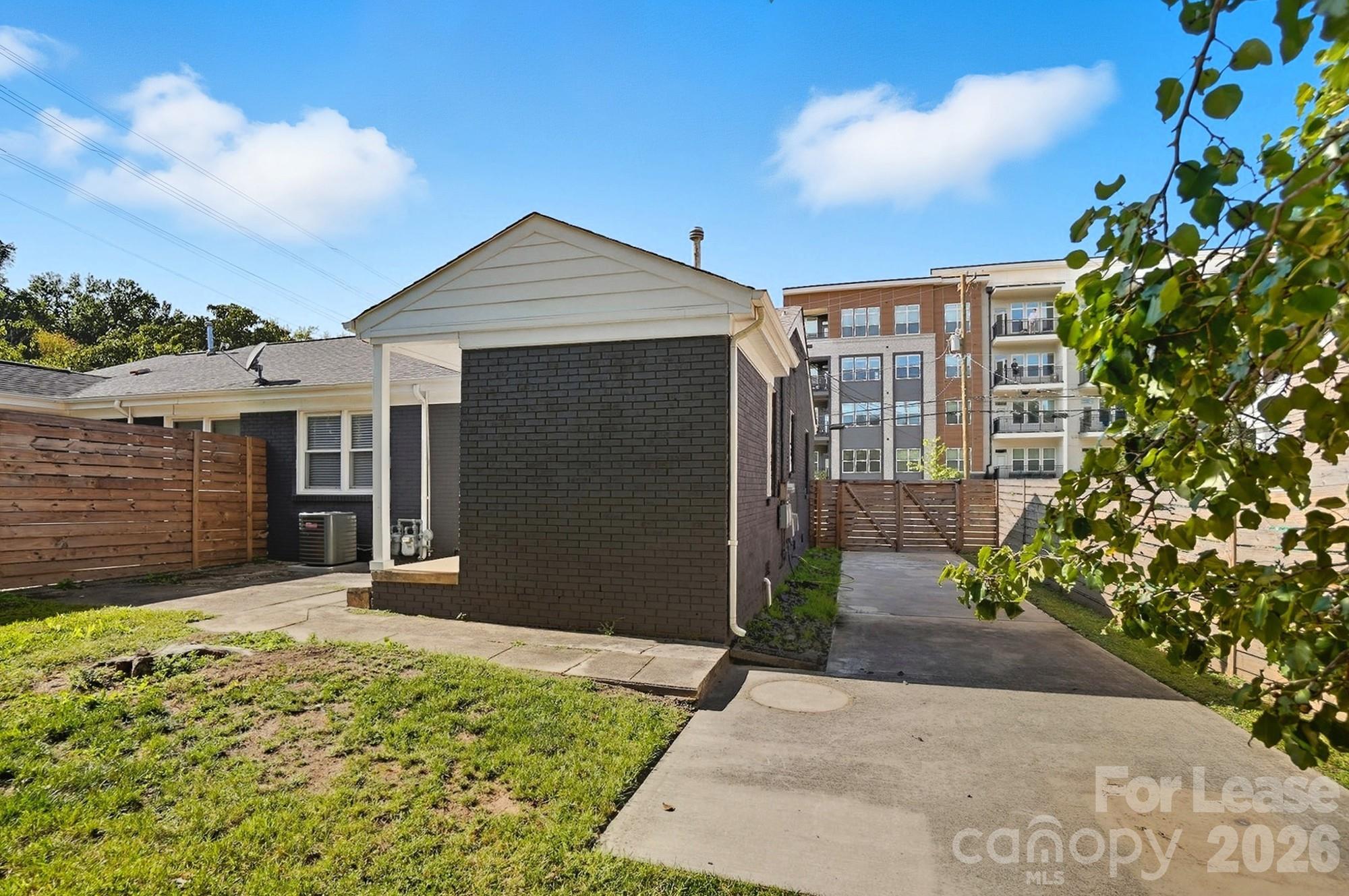 318 Hollis Road Charlotte, NC 28209 - Photo 28 of 30 a front view of a house with a yard