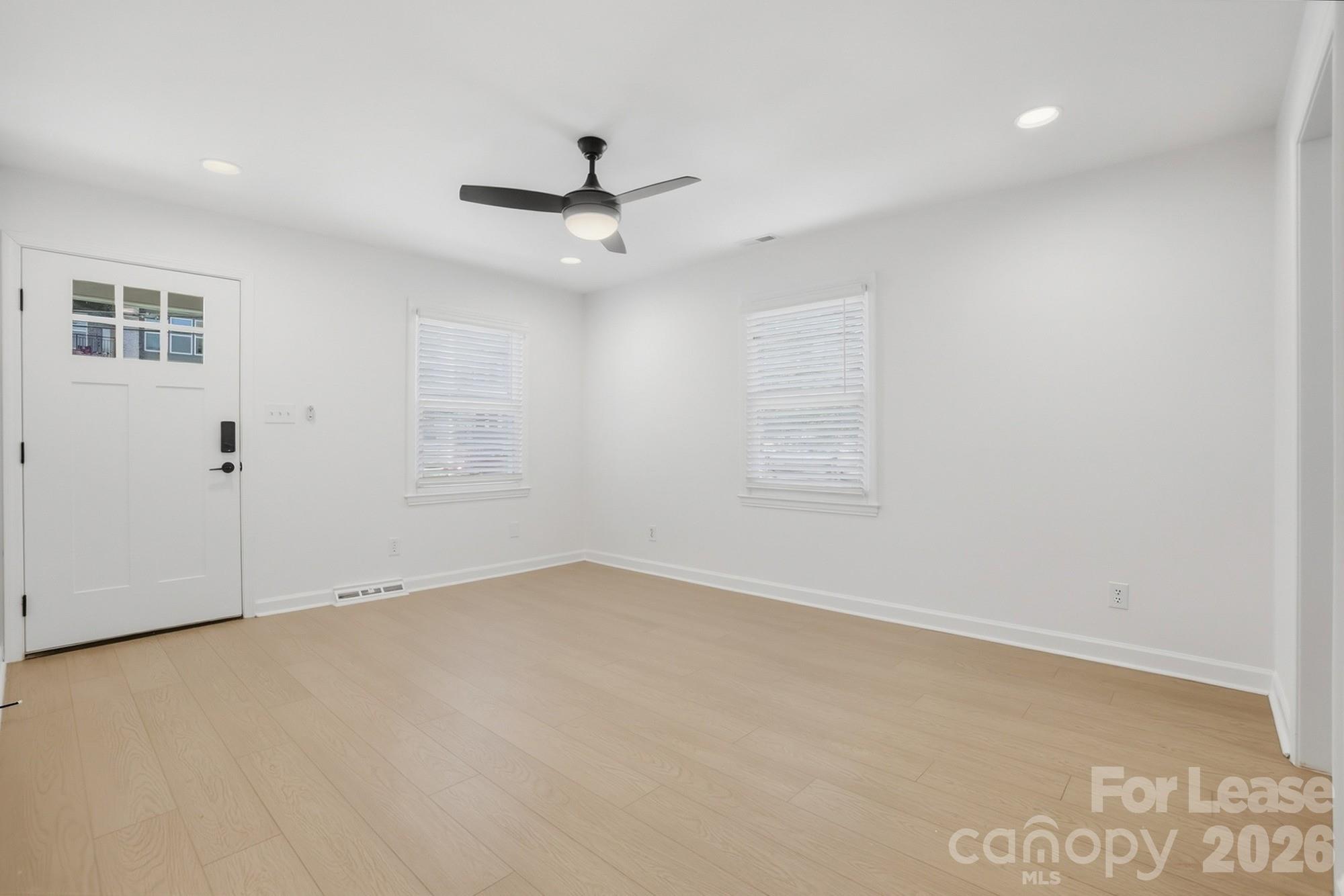 318 Hollis Road Charlotte, NC 28209 - Photo 30 of 30 an empty room with windows and fan