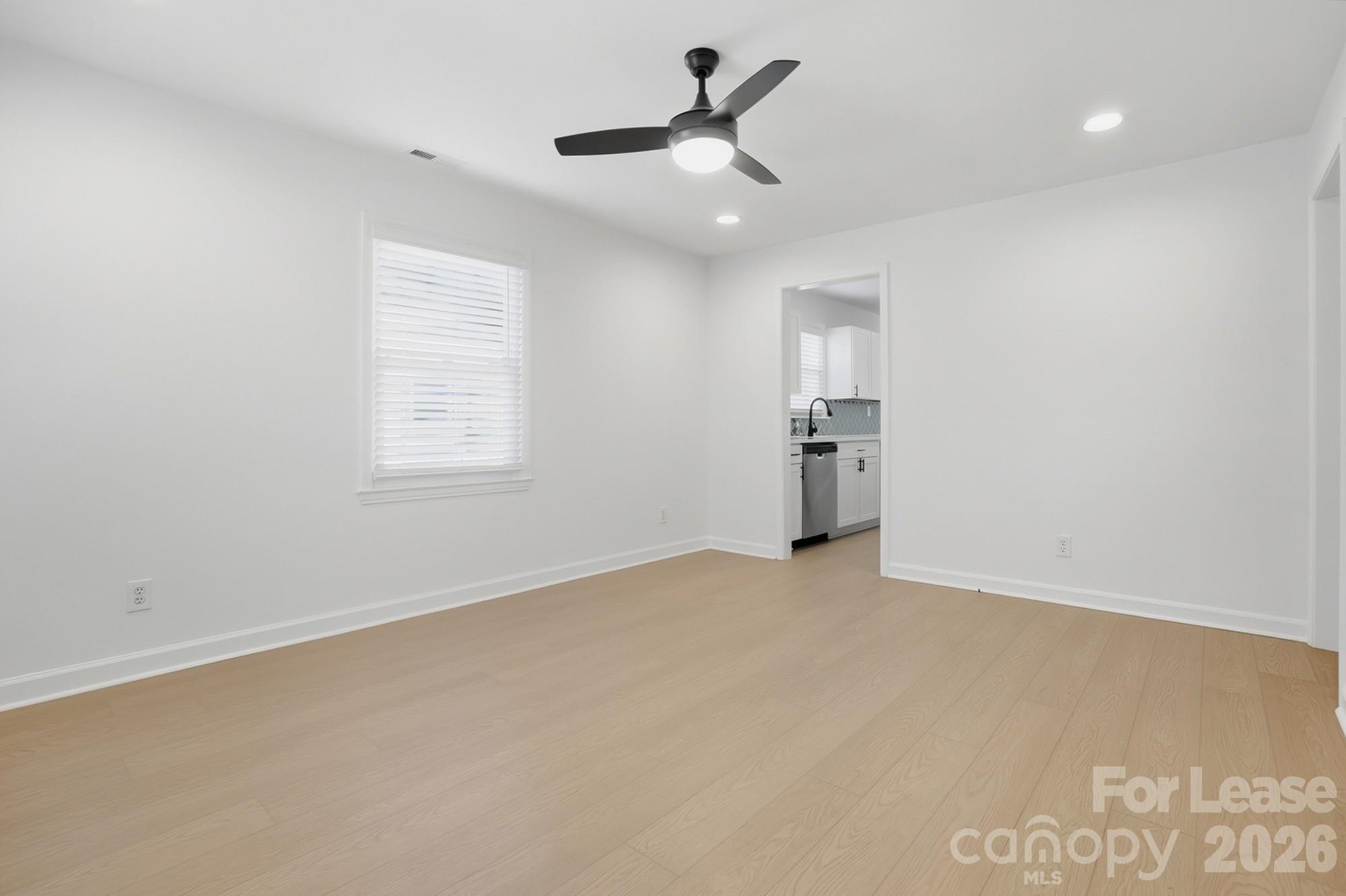 318 Hollis Road Charlotte, NC 28209 - Photo 4 of 30 an empty room with closet and windows