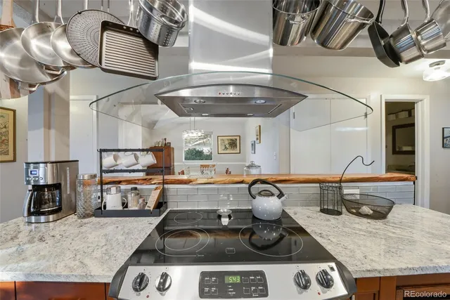 a kitchen with a stove and cabinets