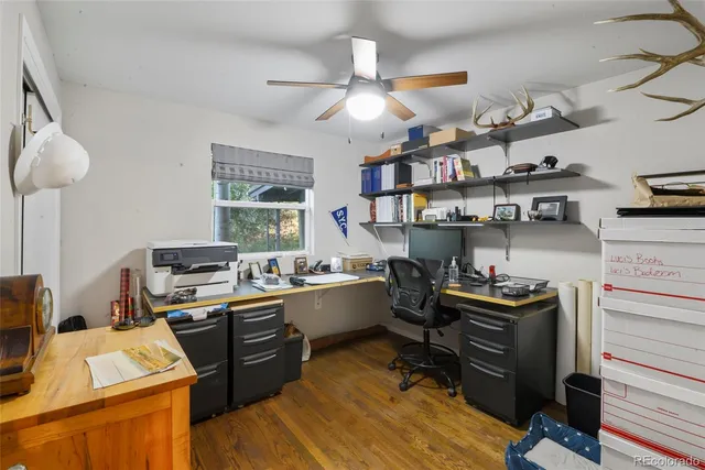 a kitchen with a stove a refrigerator and a sink
