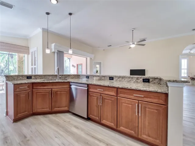 a view of a dining room with a table and chairs