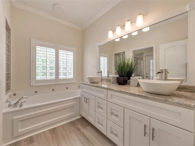 a view of a swimming pool with a lounge chairs